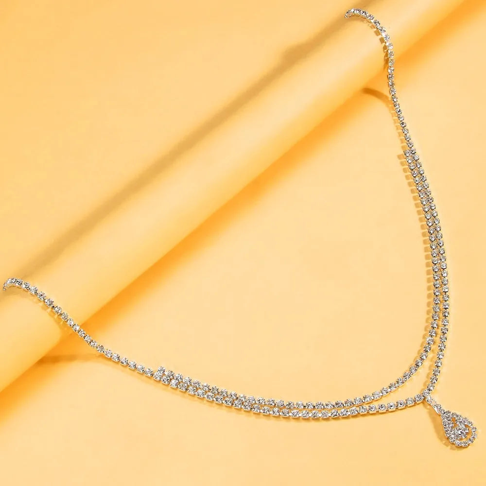 Gold waist chain with rhinestone decoration and lobster buckle clasp measuring 105cm length