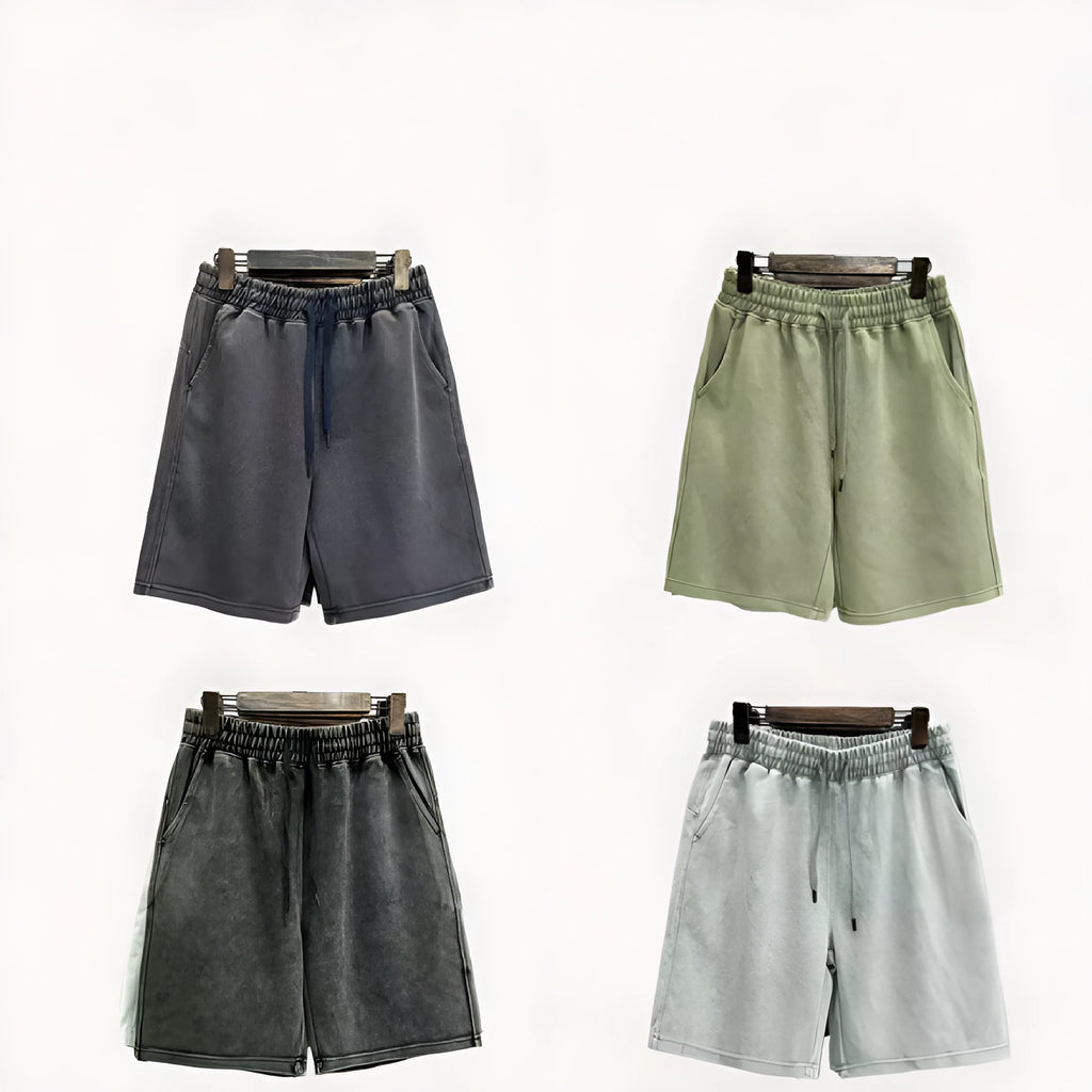 Men's distressed cotton casual shorts in a loose, straight-leg fit, shown in a solid colour.