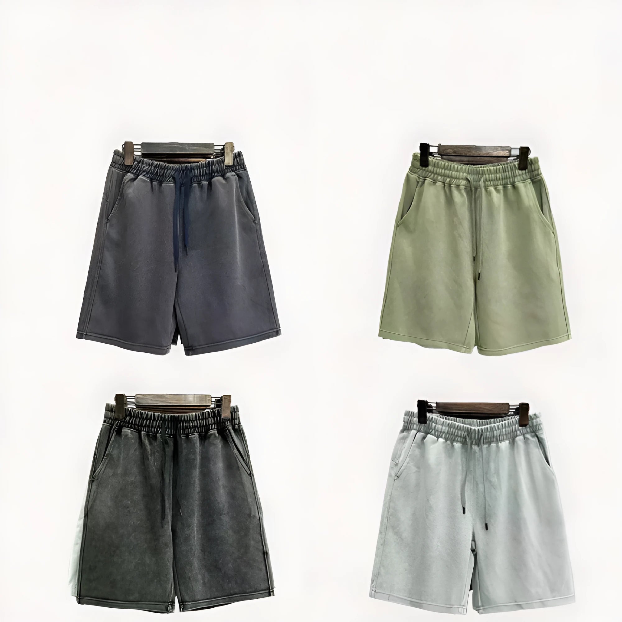Men's distressed cotton casual shorts in a loose, straight-leg fit, shown in a solid colour.