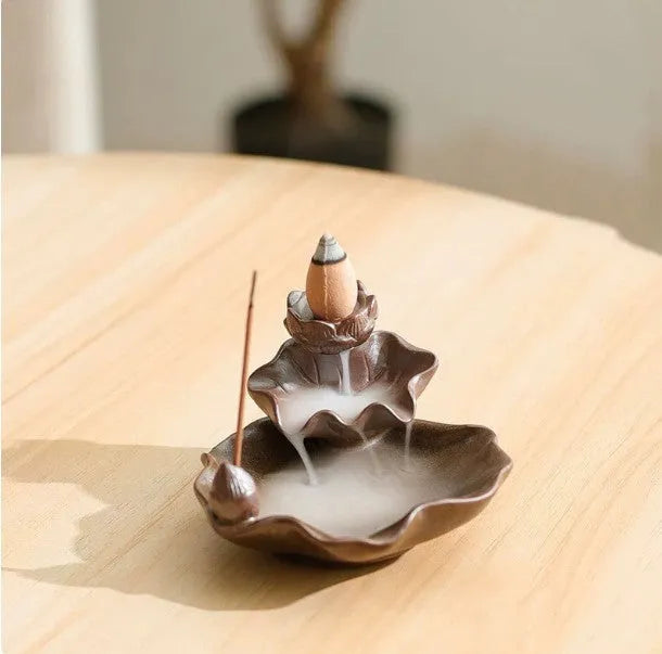 Ceramic reverse flow incense burner in purple clay with Ge kiln finish and lotus or plum blossom design