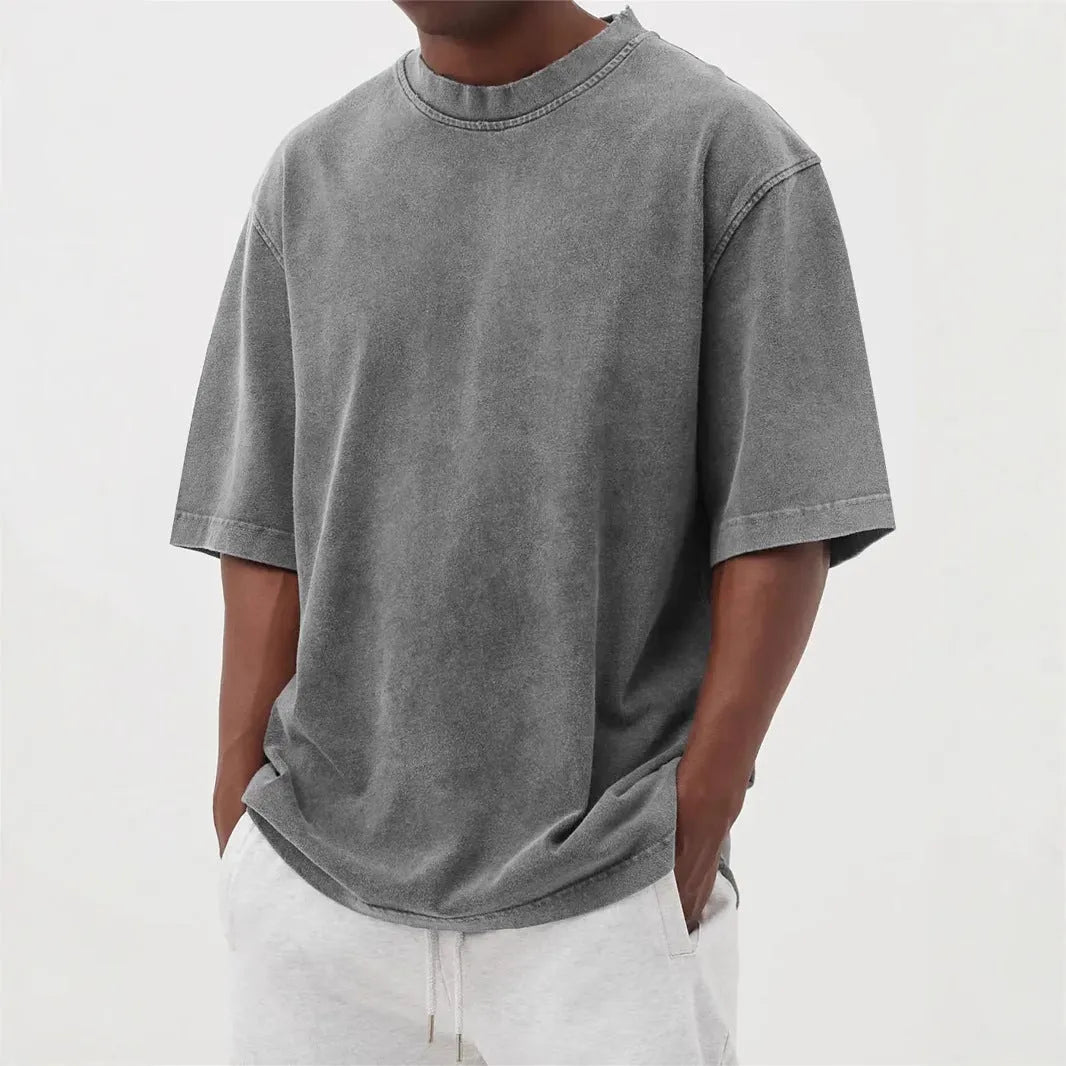 Men's loose fit distressed pullover T-shirt in solid colour options including blue, black, and army green