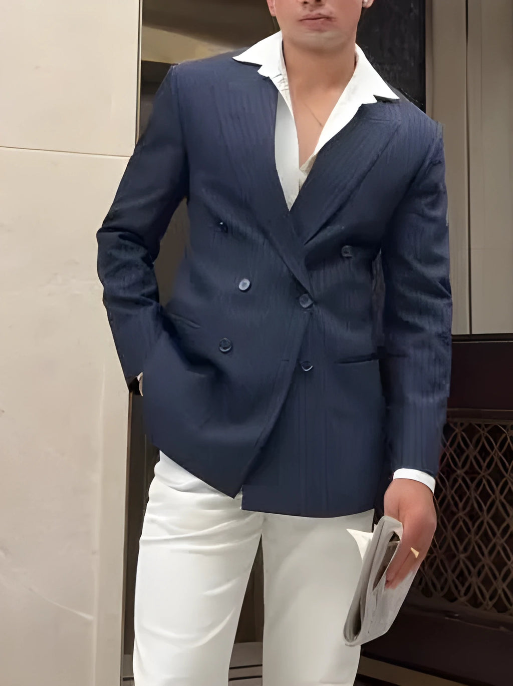 Men's striped double breasted blazer jacket on a hanger showing regular fit design