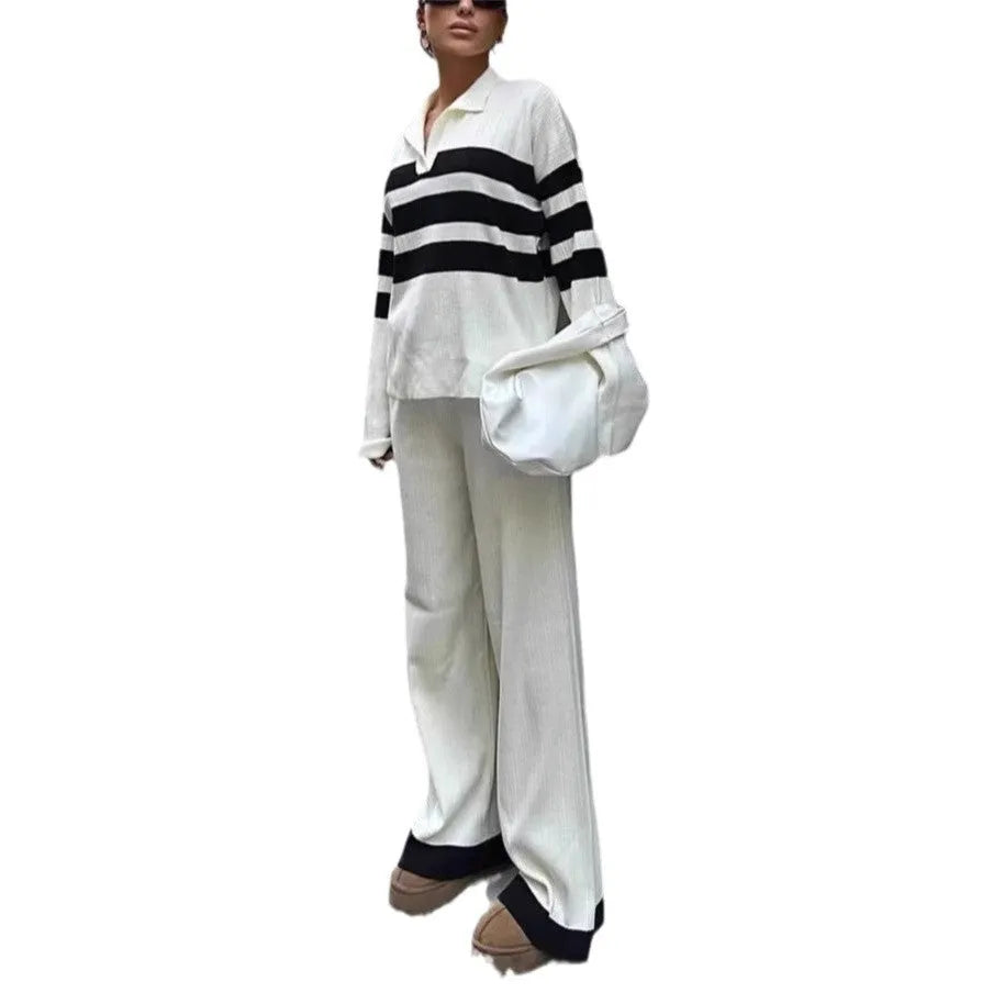 Women wearing black and white striped polo collar two-piece set with matching trousers