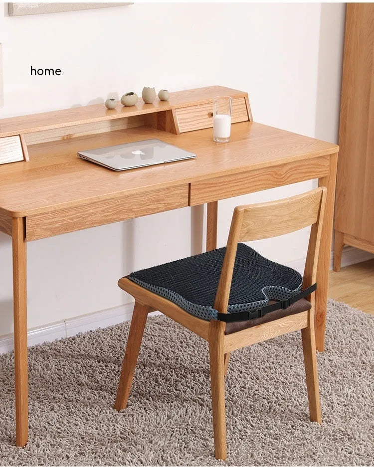 Memory foam seat cushion with adjustable strap shown in creamy white colour