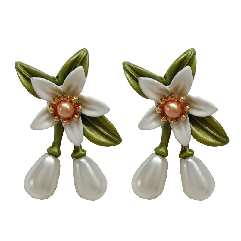 Women's camellia flower earrings set with sterling silver needle design in contrasting colours