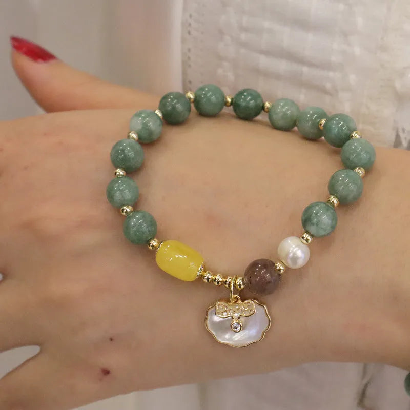 Green jade shell bracelet on a wrist showing natural stone beads and 18 cm length.