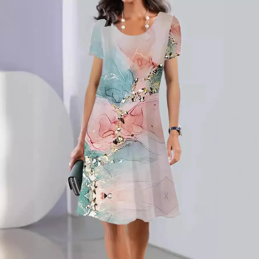 Printed mid-length summer dress with plants and flowers pattern, round neck and short sleeves
