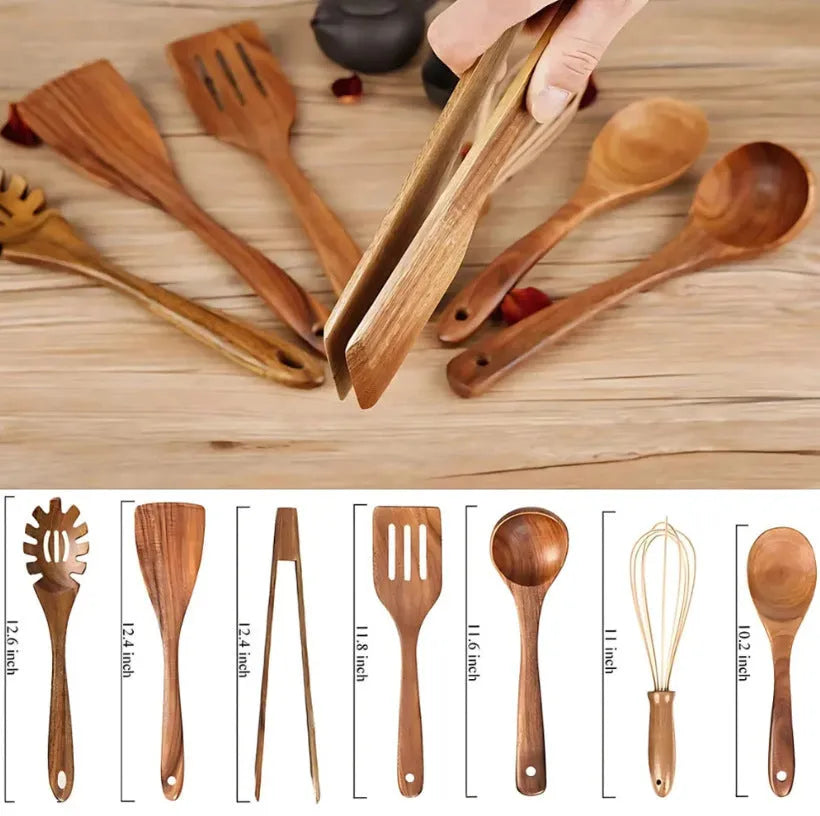 Set of 7 wooden cooking utensils including spoons and shovels arranged on a kitchen surface
