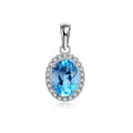 Women's 925 sterling silver and blue topaz four-piece jewellery set with geometric design, showing earrings, ring, necklace, and pendant.