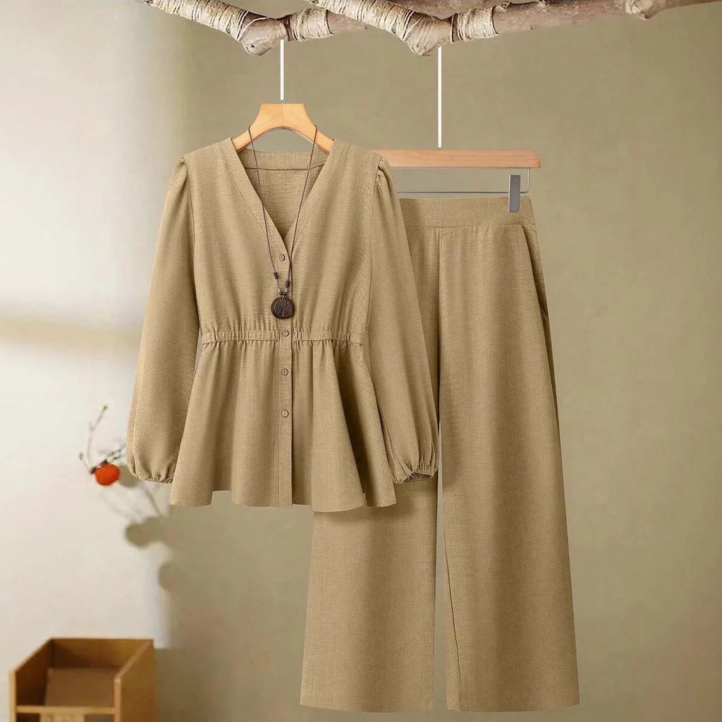 Women's long-sleeved two-piece polyester suit in khaki with button front top and matching trousers on model
