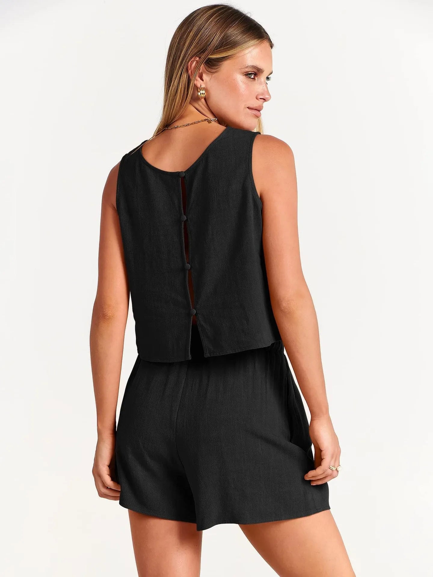 Women's two-piece summer outfit featuring a sleeveless top and drawstring shorts in a solid colour.