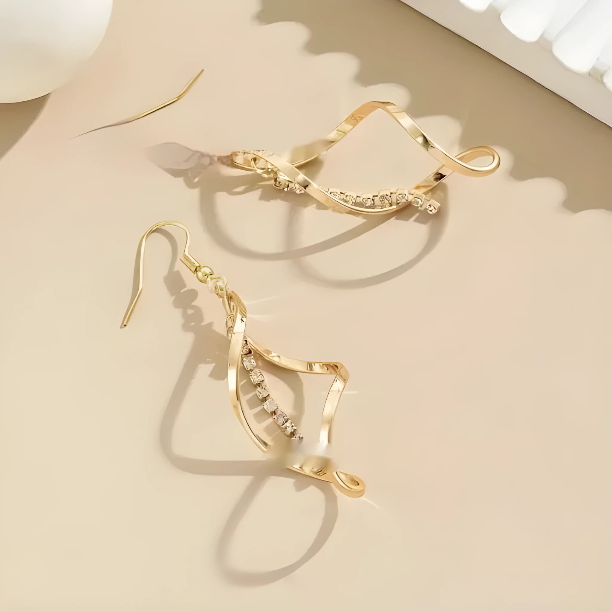 Gold-colour geometric earrings with a creative spiral and elliptical design for women.