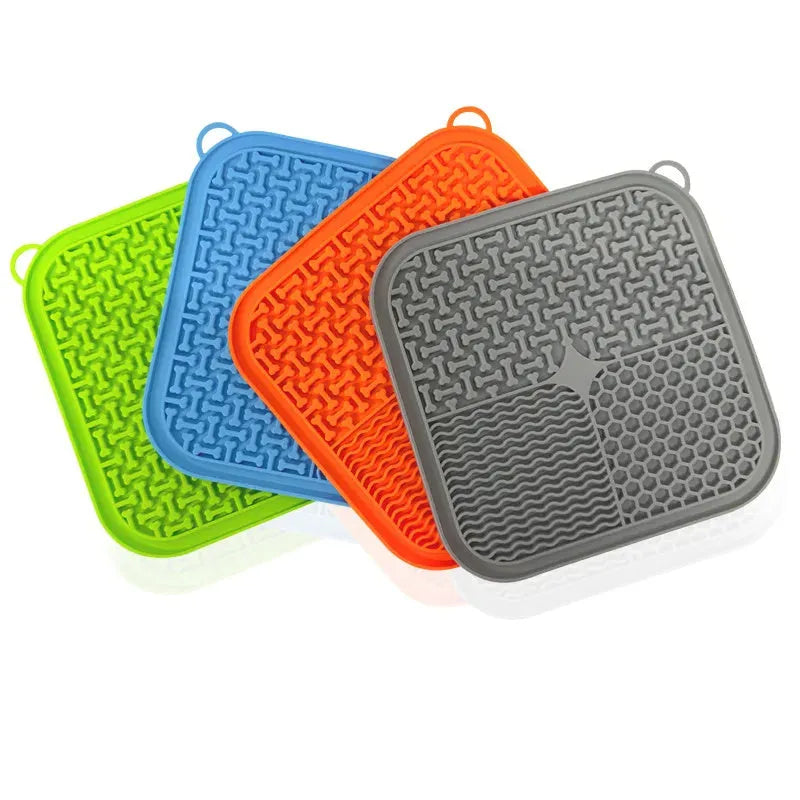 Blue silicone dog licking mat with suction cups on back, textured surface for slow feeding