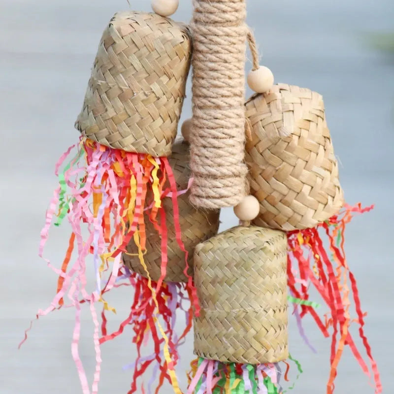 Colourful shredded paper and wood parrot hanging toy with sisal rope for medium birds.