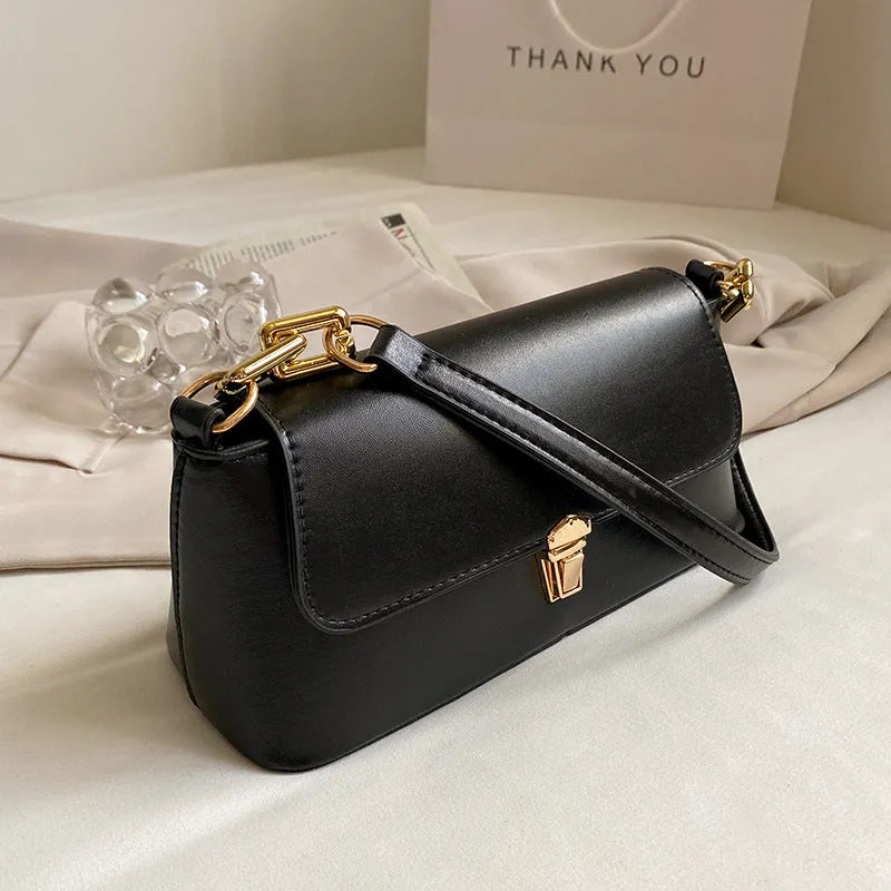 Brown French casual underarm bag with single shoulder chain, showing horizontal square shape and sandwich pocket design