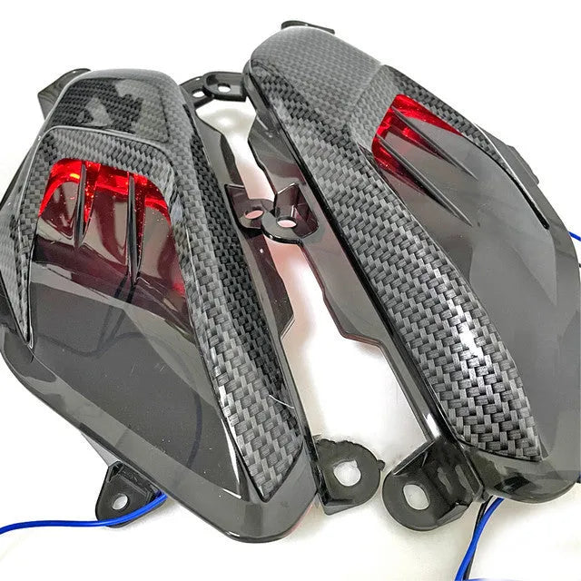 Pair of Yamaha NMAX carbon fibre style LED side lamps with blue or red light options