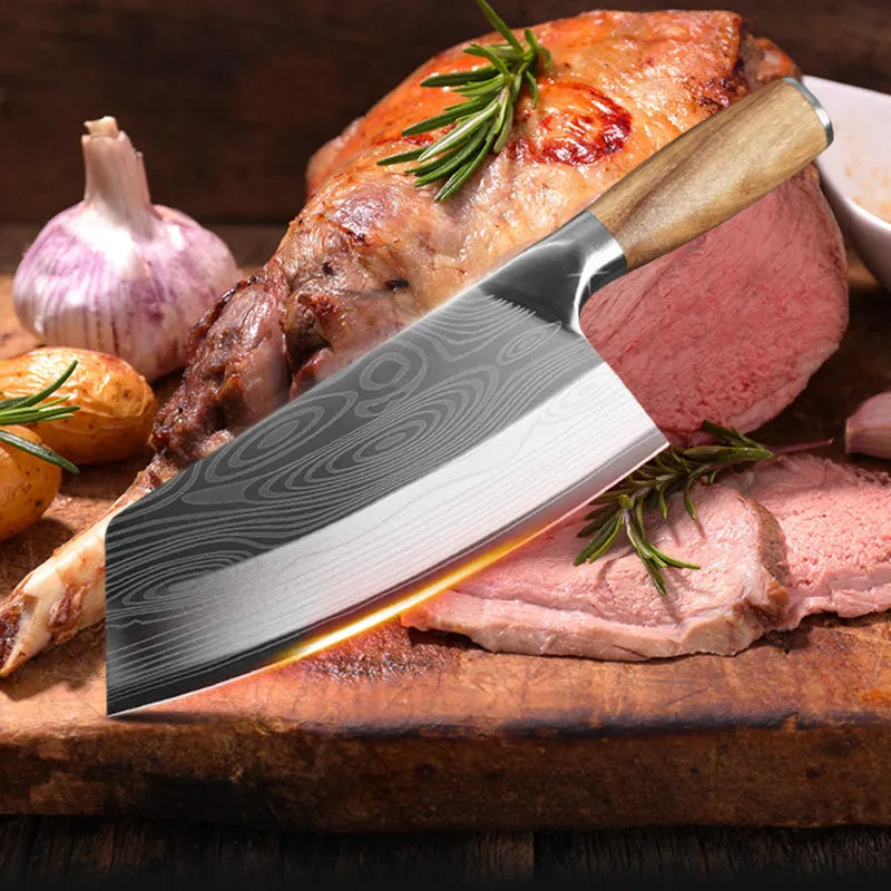 Stainless steel kitchen knife with a 320mm blade on a cutting board.