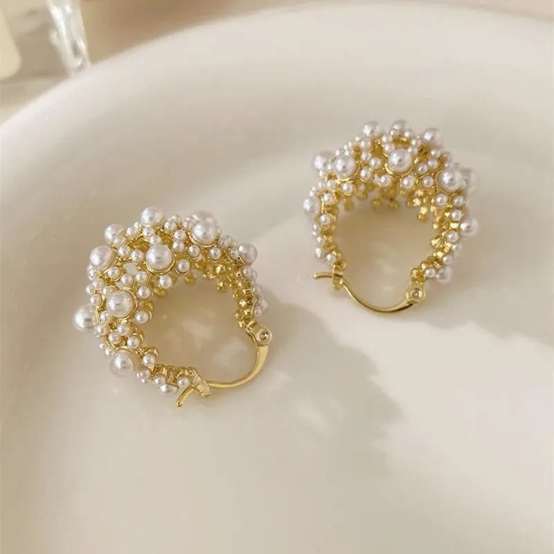 Gold-colour women's flower basket earrings with copper construction and small bead inlay detail.