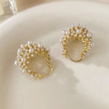 Gold-colour women's flower basket earrings with copper construction and small bead inlay detail.
