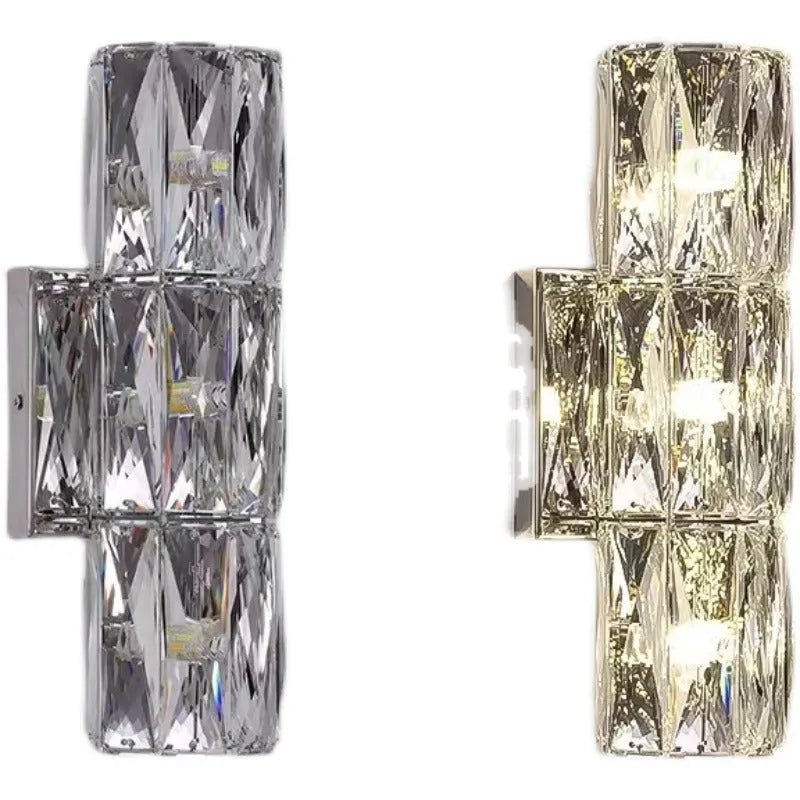 Modern crystal shade wall lamp in gold or chrome stainless steel, mounted on a wall.