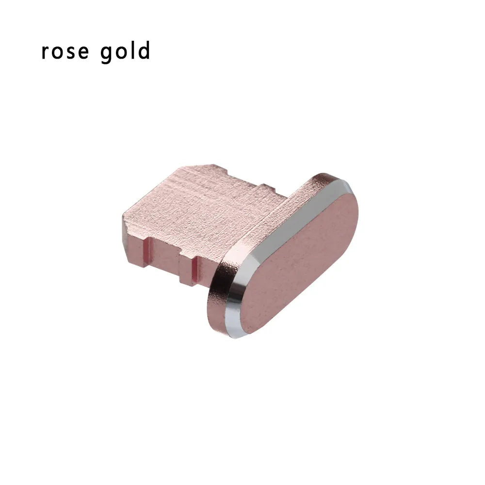 Aluminium alloy iPhone charging port dust plug in metallic colours on a dark background.