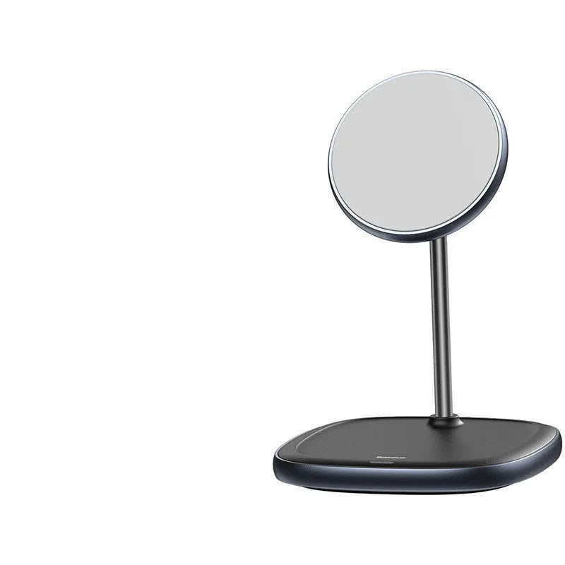 Black Swan magnetic wireless charging stand holding an iPhone 12 upright on a wooden desk.
