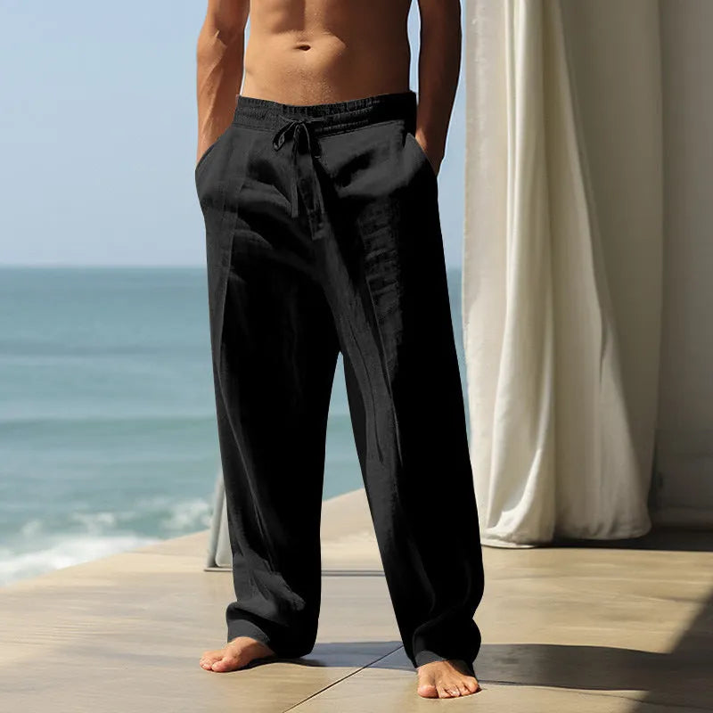 Man wearing loose-fitting solid colour cotton casual trousers in a leisure setting