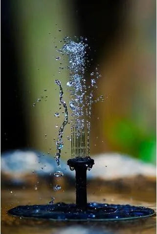 Black solar-powered floating fountain pump with four spray nozzles on a solar panel base