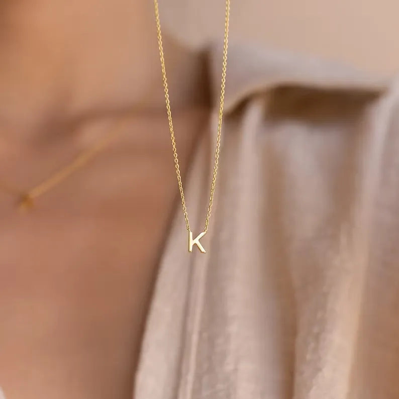 Stainless steel letter necklace with mixed gem inlaid pendant on an adjustable O-ring chain in silver finish