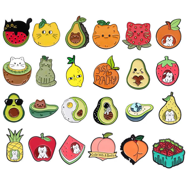 Colourful cartoon fruit shaped into a letter on a metal brooch with pin clasp.
