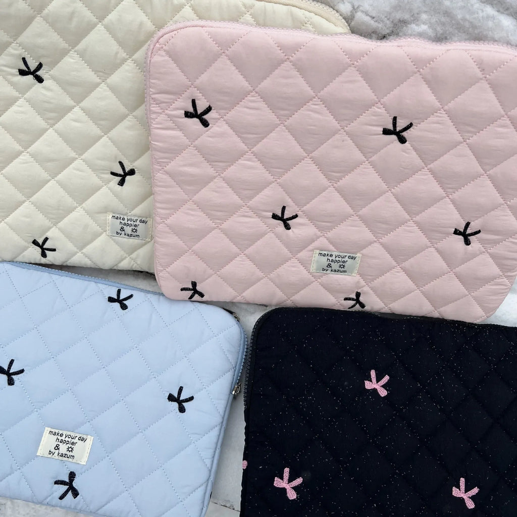 White laptop storage bag with rhombus embroidery and bow design in nylon fabric
