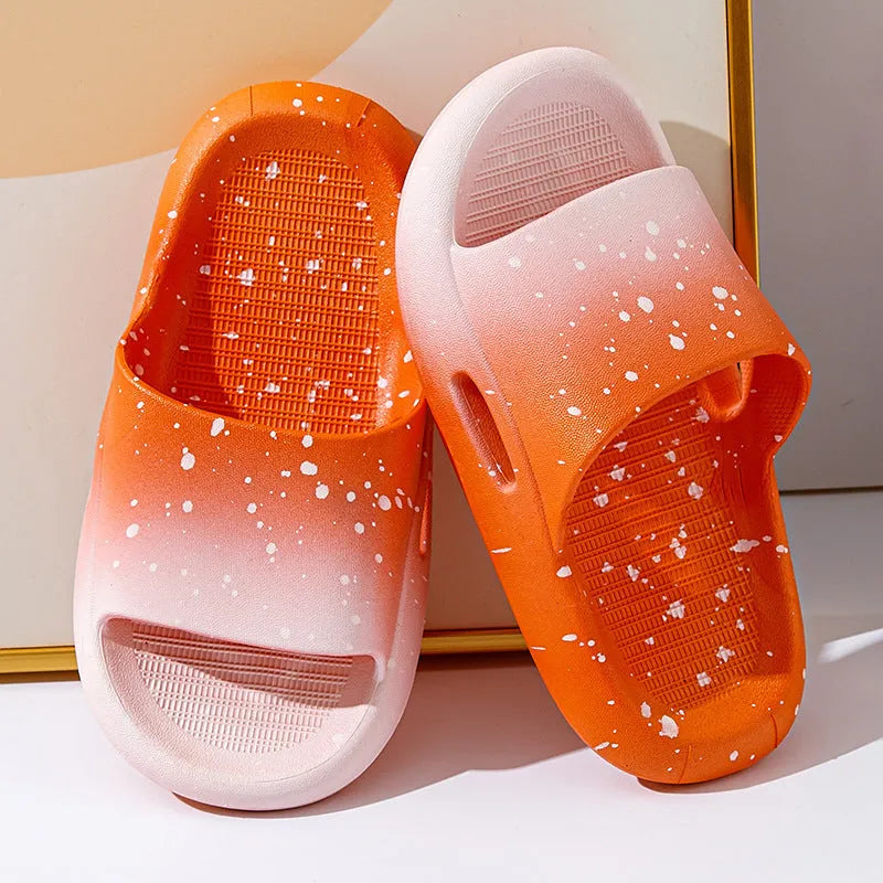 Gradient coloured PVC slipper sandals for children on a white background.