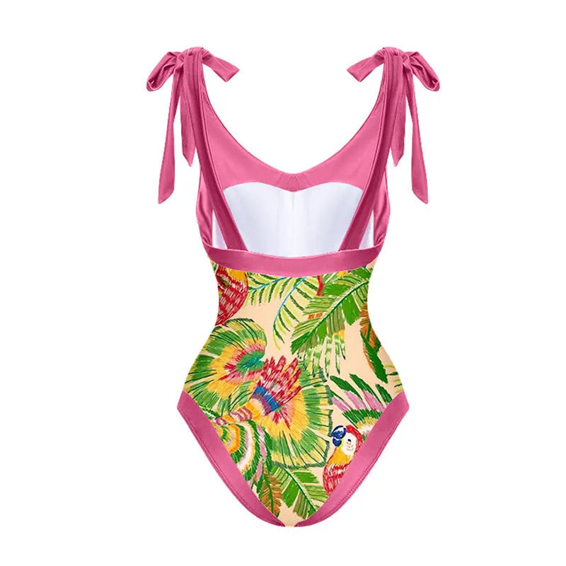 Pink floral print one-piece swimsuit with V-neck, covered belly design, and attached thin skirt