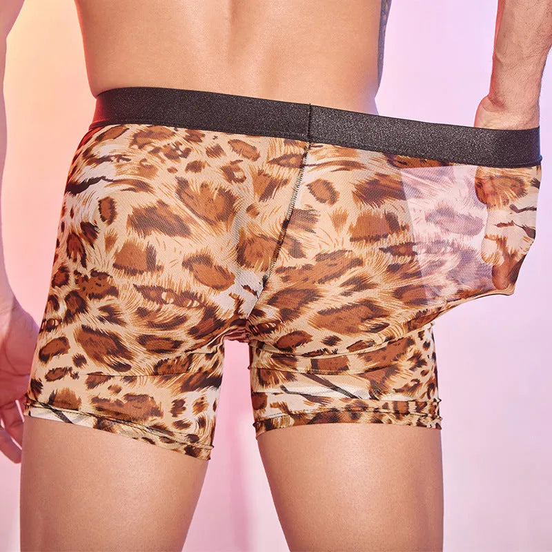 Men's leopard print nylon boxer shorts laid flat, showing the full animal pattern and elastic waistband.