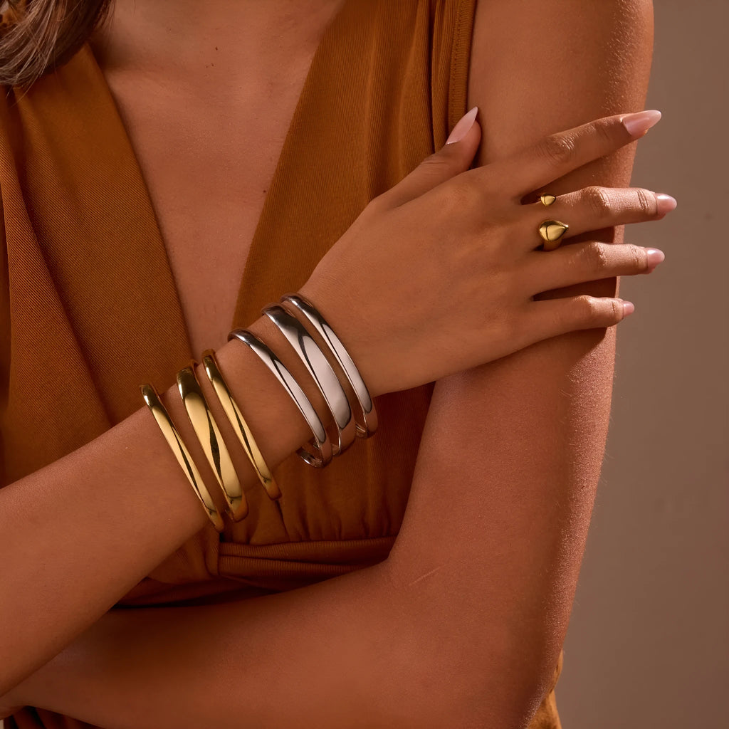 Women's stainless steel opening bracelet with geometric line design in gold or steel colour with 18K electroplated finish