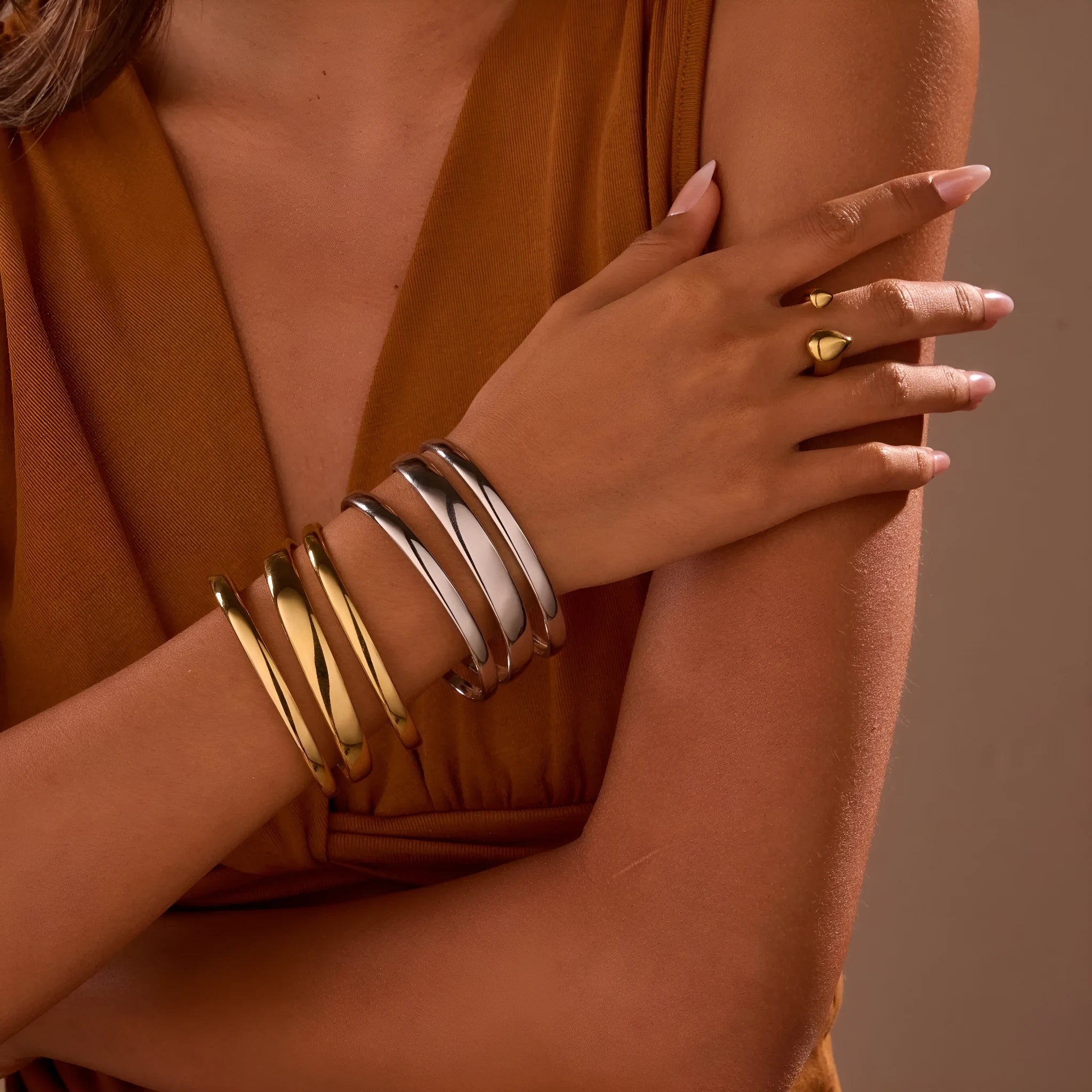 Women's stainless steel opening bracelet with geometric line design in gold or steel colour with 18K electroplated finish