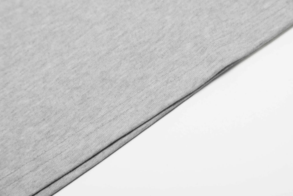 Men's loose fit black and grey cotton long sleeve casual T-shirt on a hanger.