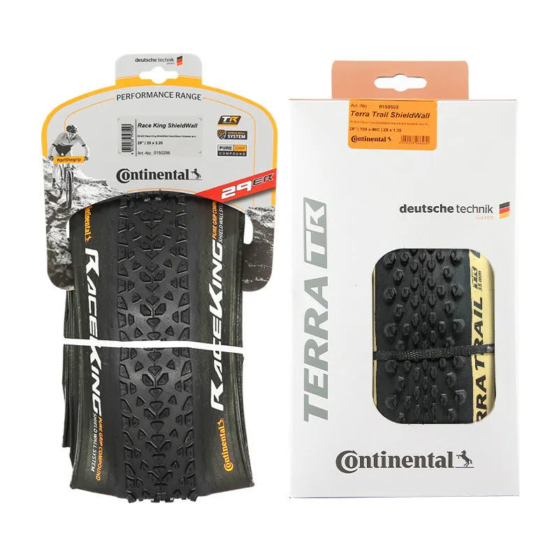 Mountain bike outer tyre showing yellow sidewall, with folding bead and tread pattern for off-road use.