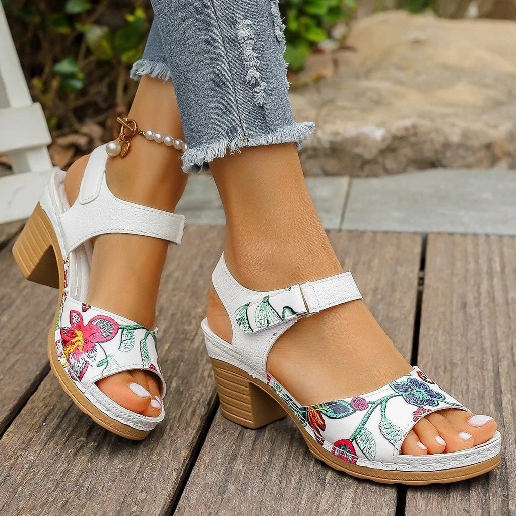 White women's high heel sandals with adjustable Velcro buckle strap on a casual rubber sole.