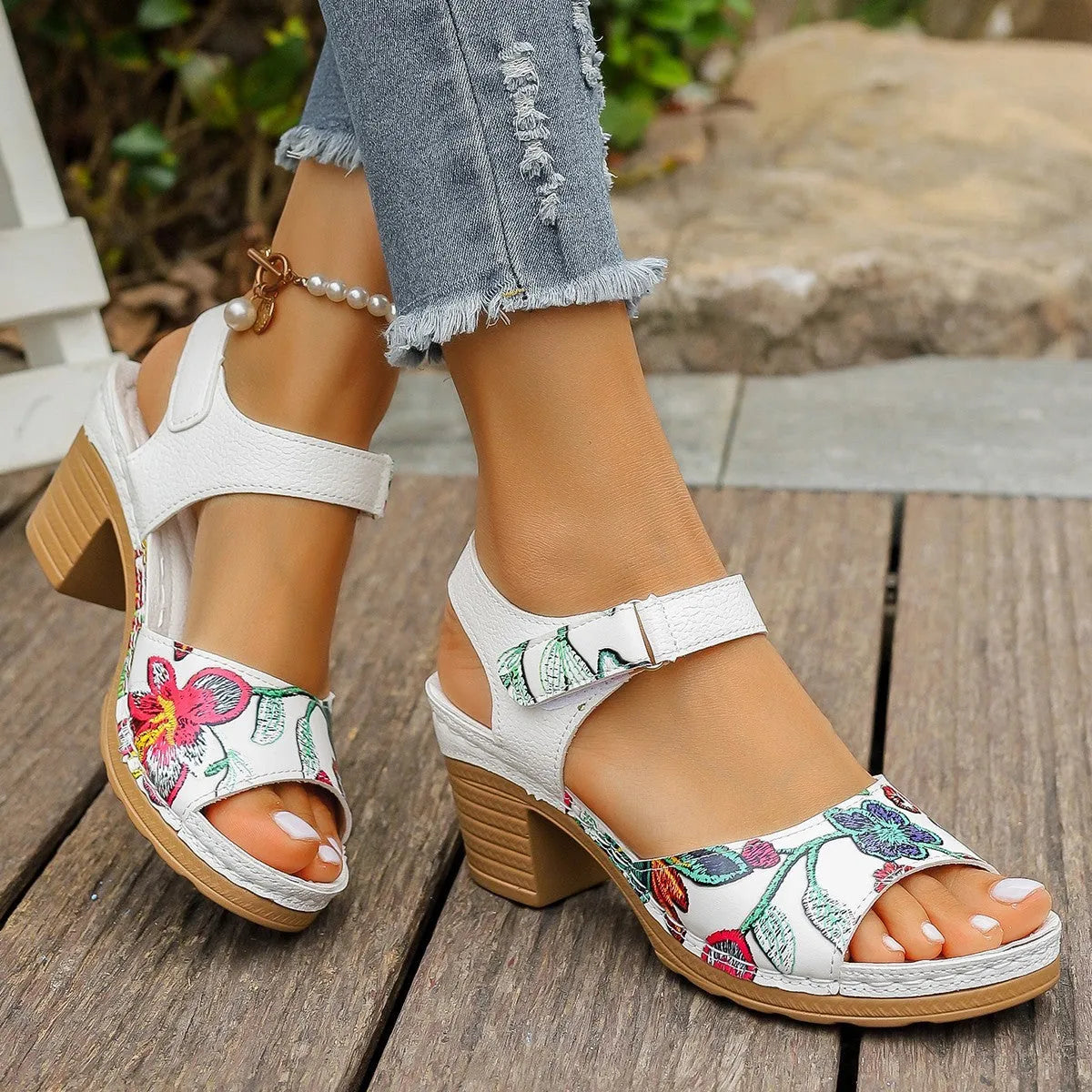 White women's high heel sandals with adjustable Velcro buckle strap on a casual rubber sole.