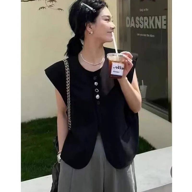 Women's loose-fitting solid colour polyester vest with a pocket, shown in milky white.