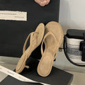 Women's open-toed stiletto sandals with round toe in rubber material, available in sheepskin camel and black
