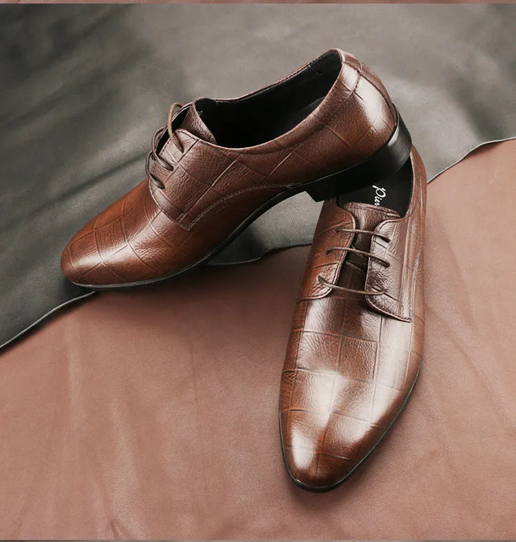 Men's black checkered leather derby shoes with a pointed toe on a rubber sole