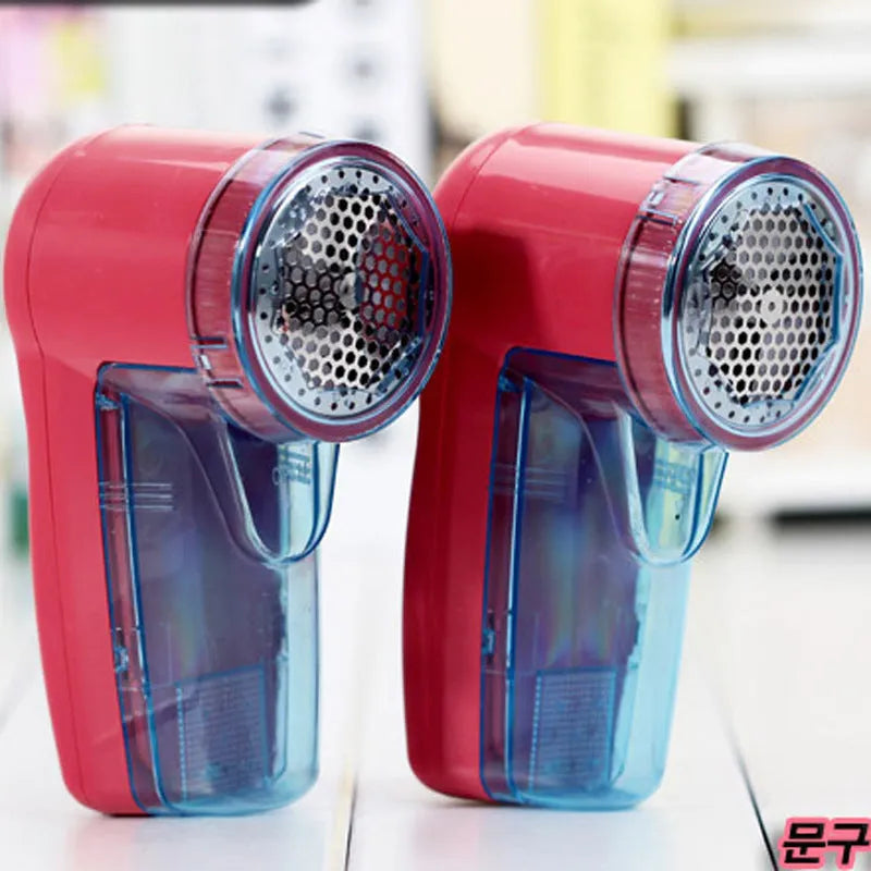 Portable electric clothing lint remover with compact rectangular design showing dimensions