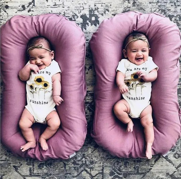 Beige portable cotton baby nest crib for newborns measuring 75cm by 45cm