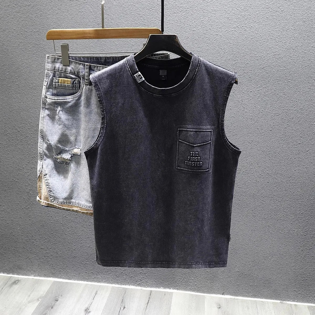 Men's black cotton sleeveless t-shirt with loose fit and straight hem design