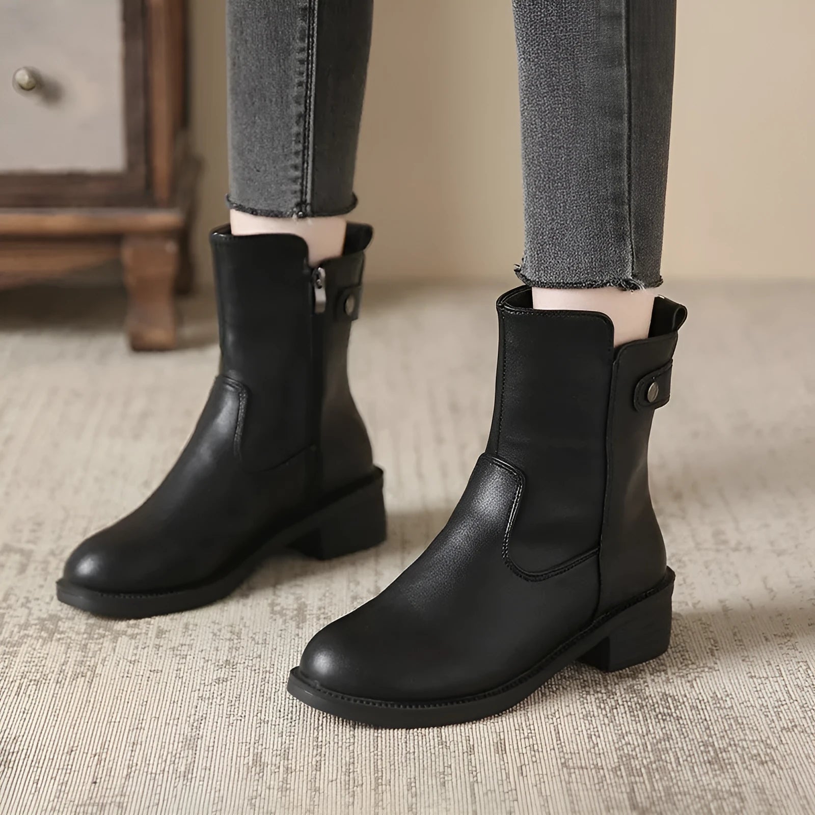 Black women's ankle boots with side zipper and low heel on round toe