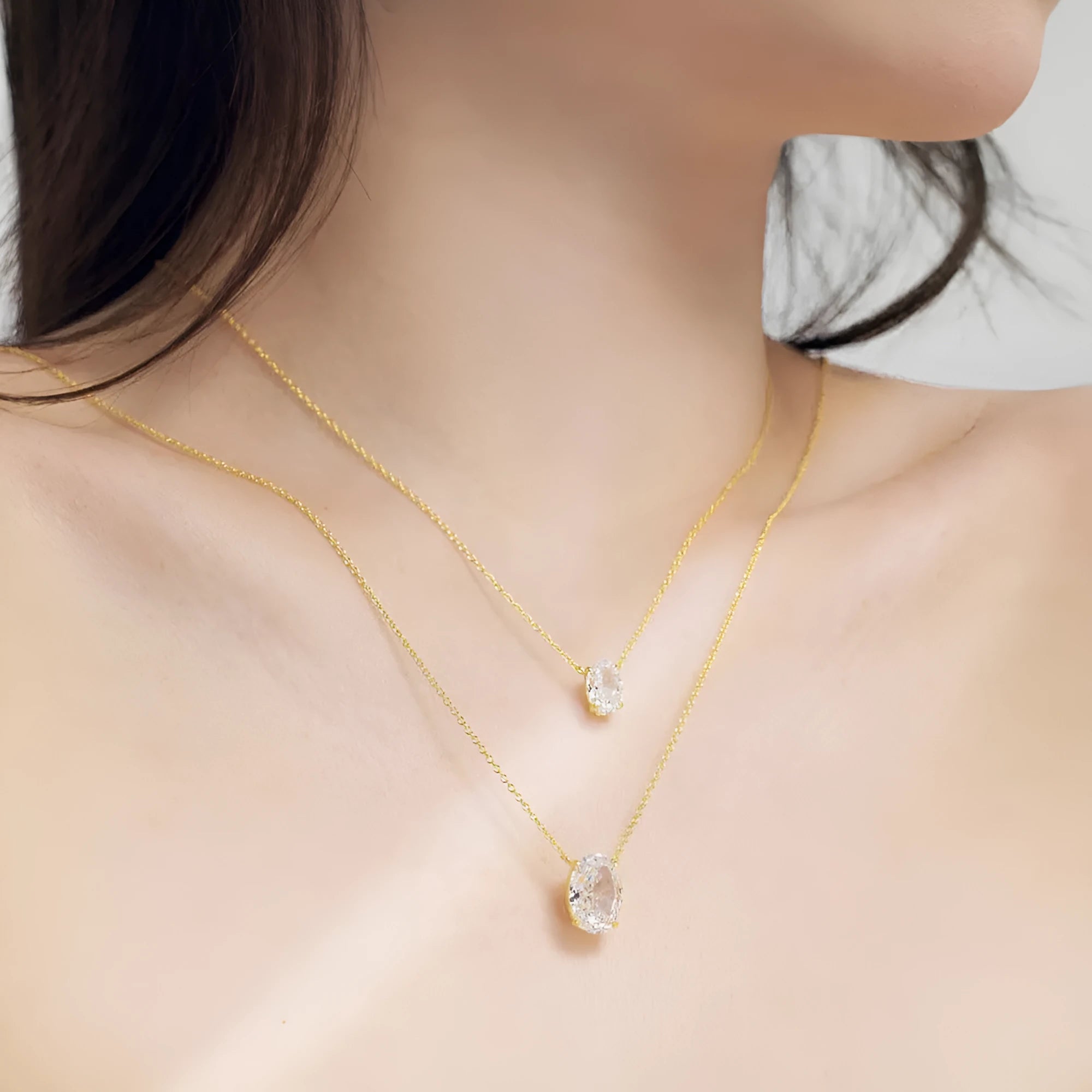 Oval ice flower geometric pendant on a sterling silver necklace with a choice of platinum or gold electroplated finish.