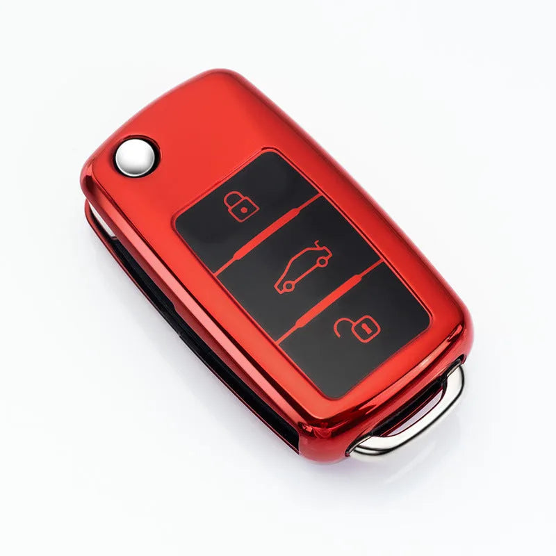 VW Model A folding car key case in TPU material showing colour options: silver, blue, pink, and red.