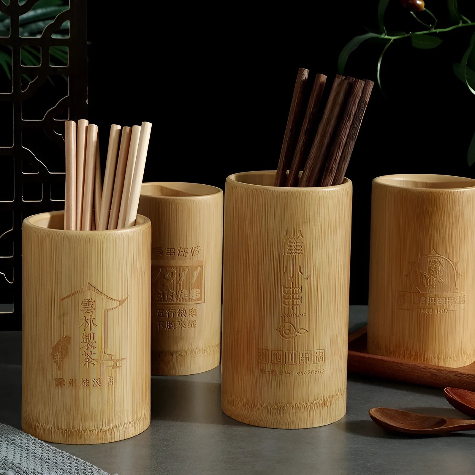 A bamboo chopsticks holder tube in a creative style, such as bevel or groove, showing its portable design for utensil storage.